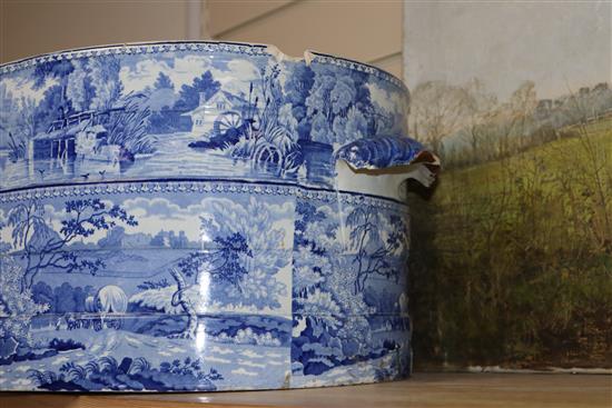 A 19th century Staffordshire blue and white foot bath (restored), with a small table